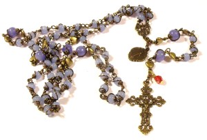 Sweet baby blue 4mm Ave beads with a special true bronze center, Mary medal, and Crucifix. This rosary, though smaller, continues the built-to-last tradition. special low price of $48